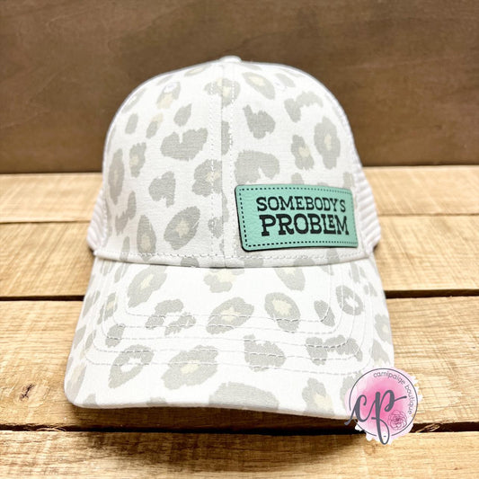 Somebodys Problem - Engraved Leather Patch Hat White & Grey Leopard Print Womans Mesh Trucker
